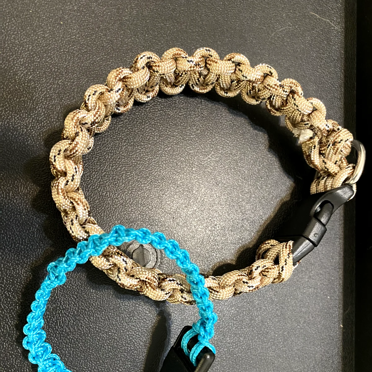 Two finished handwoven paracord collars by Pitter Paw Collars